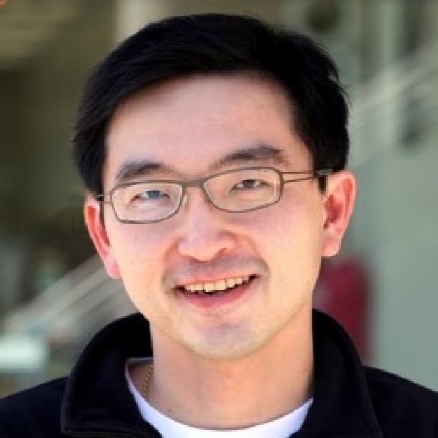 smiling headshot of Kevin Wang