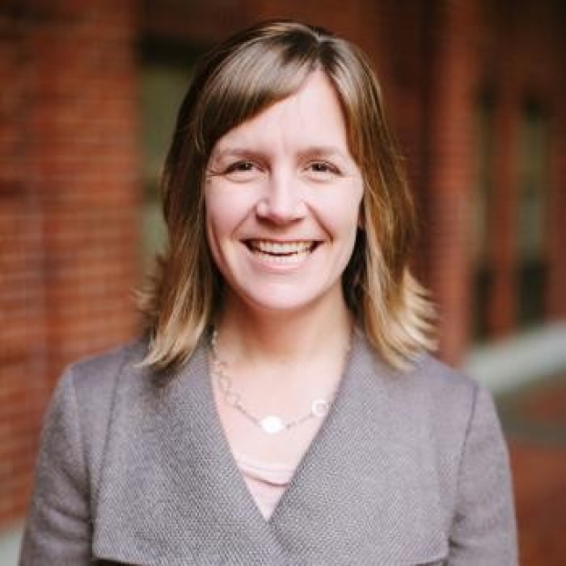 smiling headshot of Michelle C. Odden, PhD