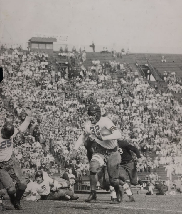 1929 photo of a running Stanford football player